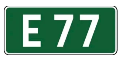 znak na zielonym tle z białą ramką i białym,napisem E77