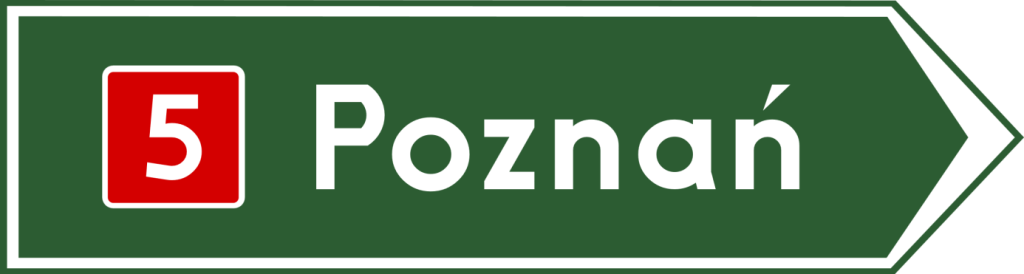 drogowskaz na miejscowość na zielonym tle z białą ramką, nazwą miejscowosci i czerwono-białym numerem drogi